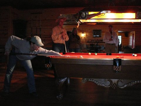 Brenda Hughes shooting pool with Buck at Devil Woman Saloon 